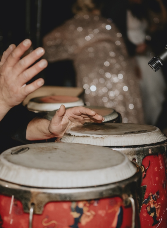 Close-up of a live percussionist playing hand drums at a wedding
